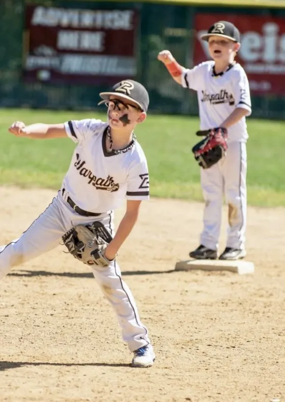 A young Warpath pitcher throwing