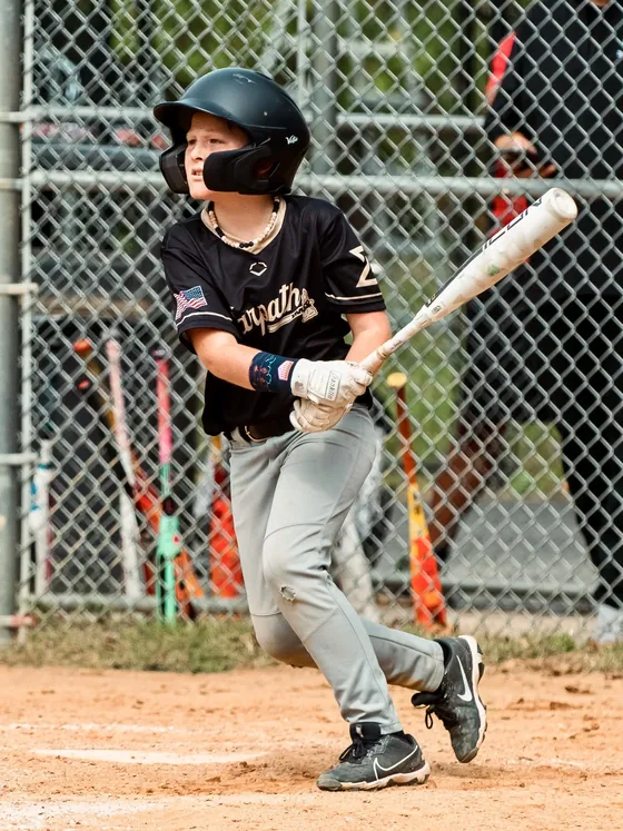 A young Warpath hitter after a swing