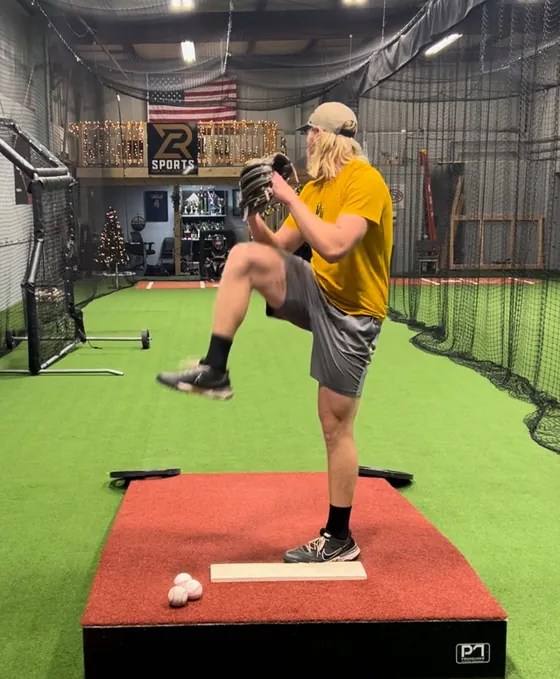 A pitcher on the indoor mound at RCS Academy