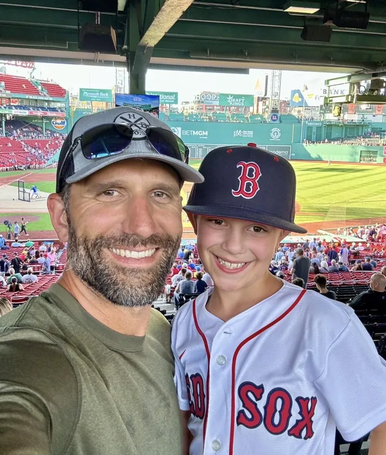 Russ Canzler with his son at a ballpark